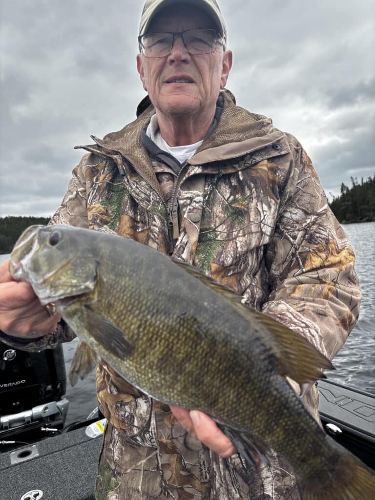 Mike Eilertsen with small mouth bass June 2025